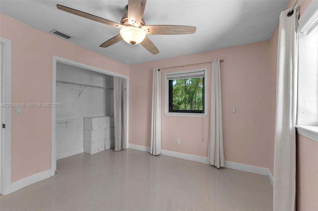 Primary bedroom with large closet and direct access to the beautifully updated en-suite bathroom.