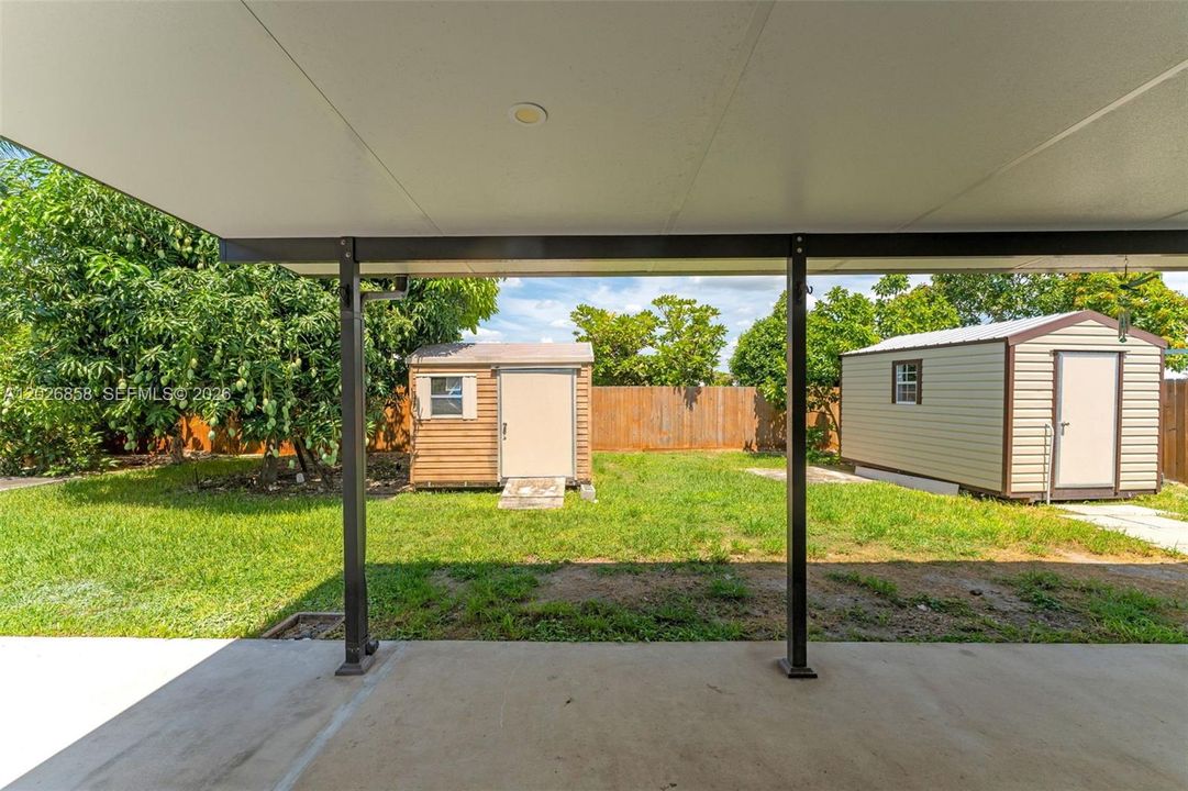Covered patio perfect for outdoor dining, entertaining, or relaxing year-round.