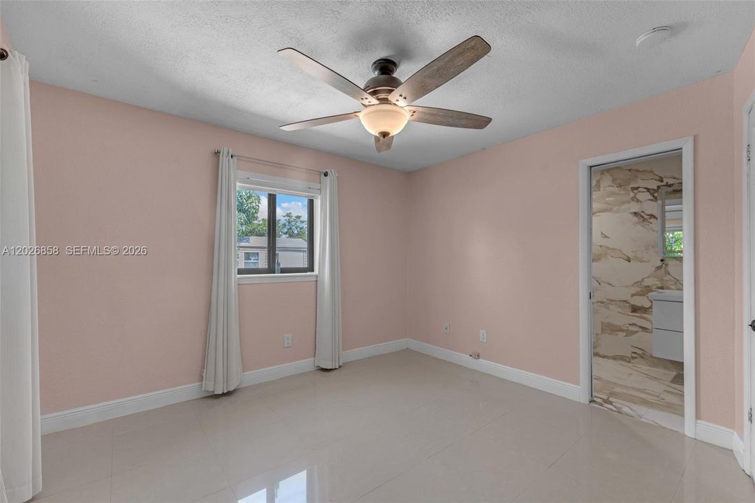 Expansive primary suite offering plenty of room for a king-sized bedroom set.
