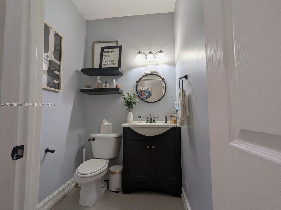 Elegant guest bathroom featuring refined décor, modern fixtures, and a thoughtfully designed layout that enhances both style and functionality.