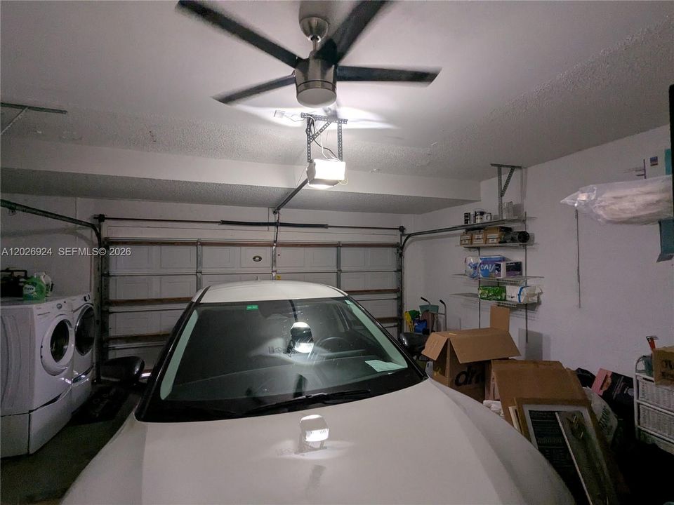 Well-maintained garage offering secure parking, additional storage options, and a dedicated laundry area for added convenience.
