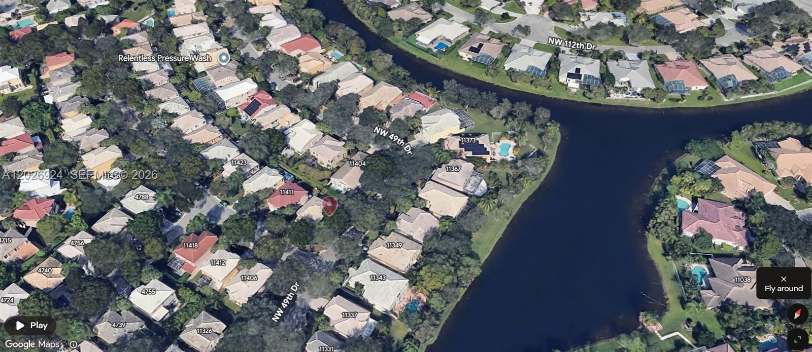 The aerial view showcases a perfectly quiet residential area, surrounded by water and lush greenery—an ideal setting that highlights the peaceful environment and natural beauty of the community