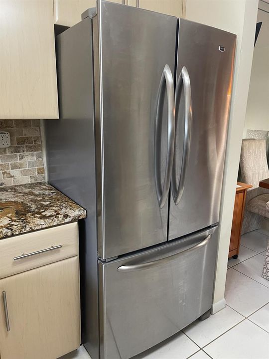 Bottom loading freezer and ice maker in