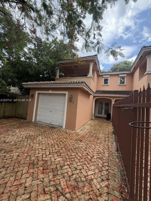 Entrance with 1 car garage and extra parking