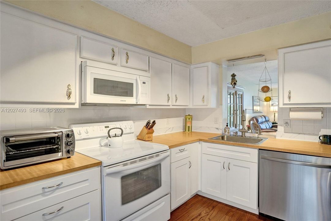 Butcher Block Counters Accent the White Kitchen!