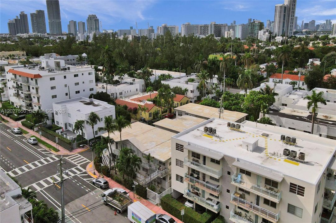 Flamingo Park with pool and tennis courts is in the background.  717 Espanola Way is the tan roof building