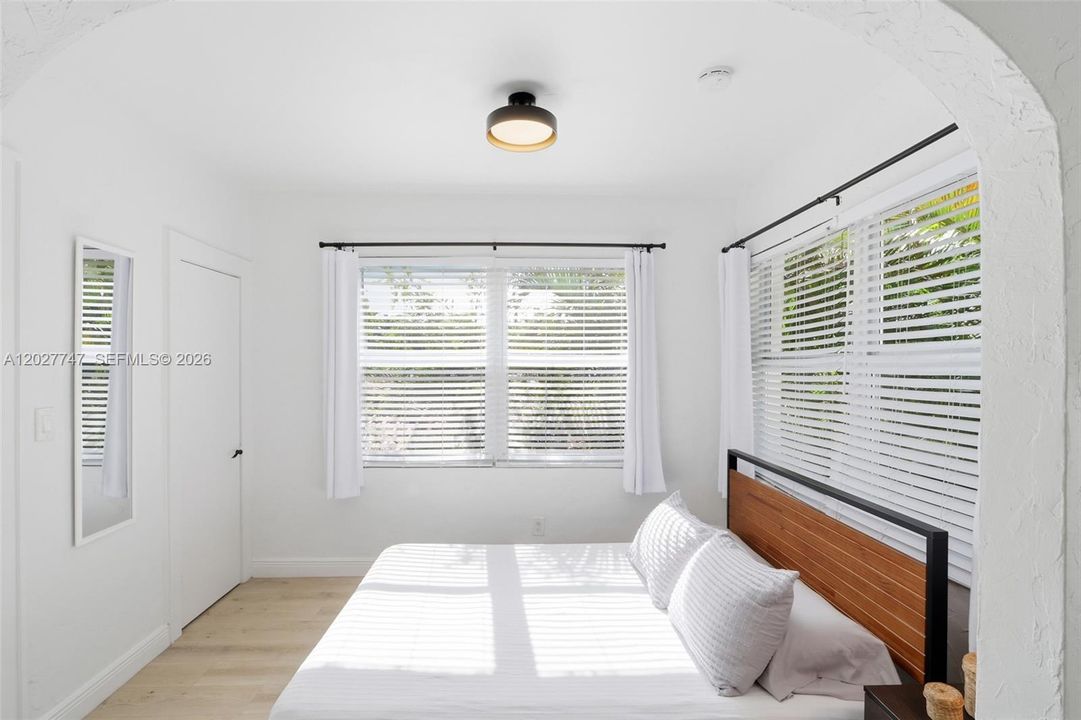 Spacious, light-filled bedroom area in the apartment.