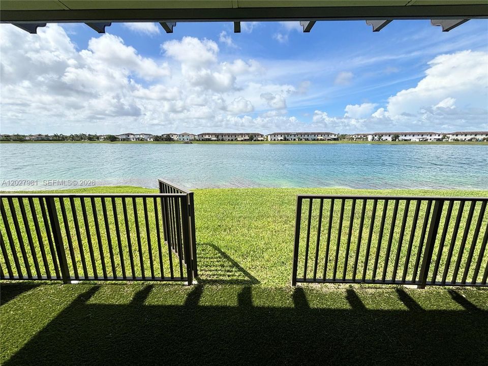Fence and gated private backyard and patio with stunning lakefront views.