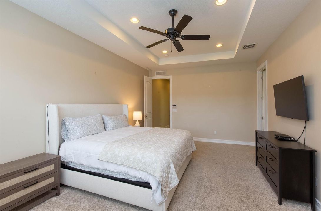 Primary suite outfitted w/ TV