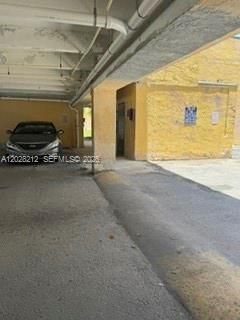Elevator access located just steps from assigned parking space #203.