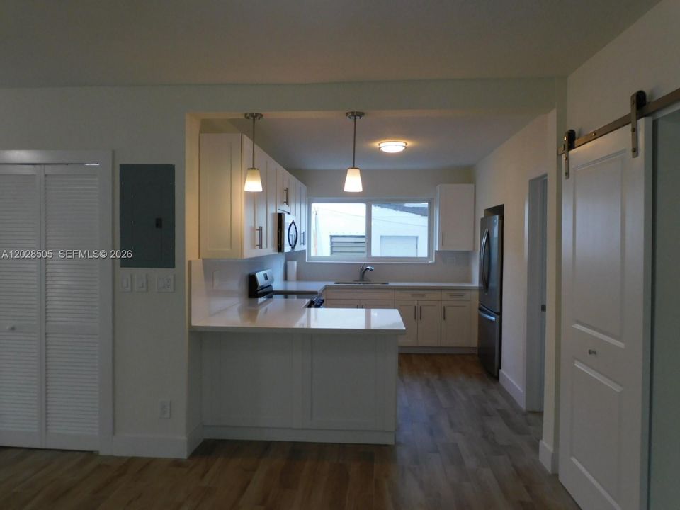 Kitchen sits right off dining area.