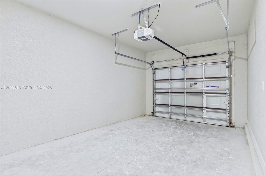 Attached 1-car garage with additional storage space.