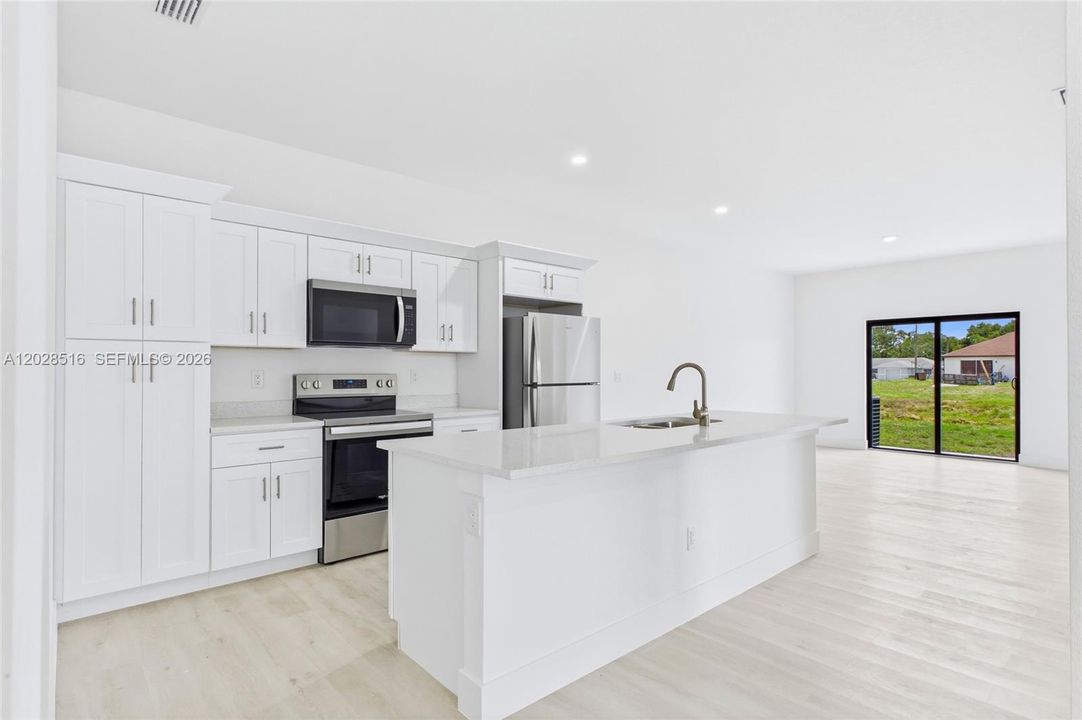 Bright and functional kitchen in Unit 2 perfect for cooking and entertaining.residence with clean, modern finishes throughout.