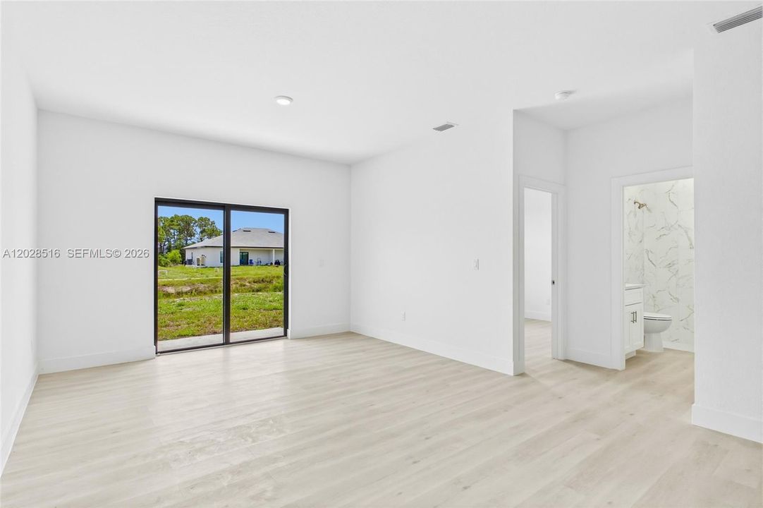 Open and airy living room in Unit 2 perfect for relaxing or entertaining.