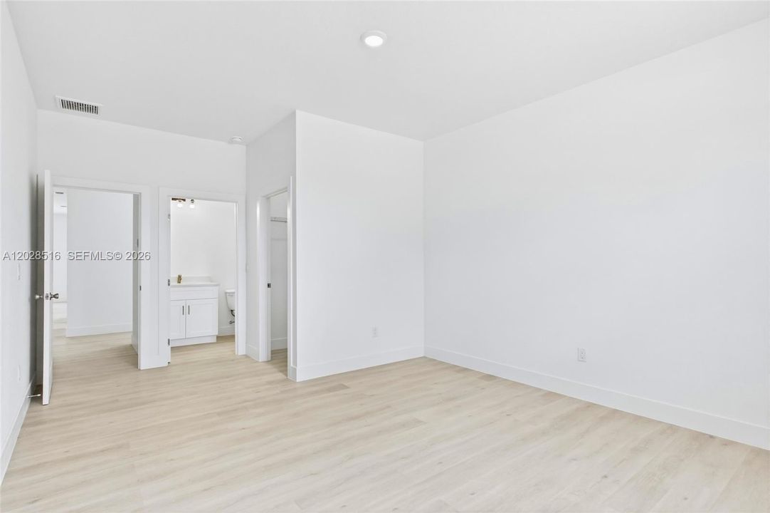 Elegant primary suite featuring a calming and inviting atmosphere.