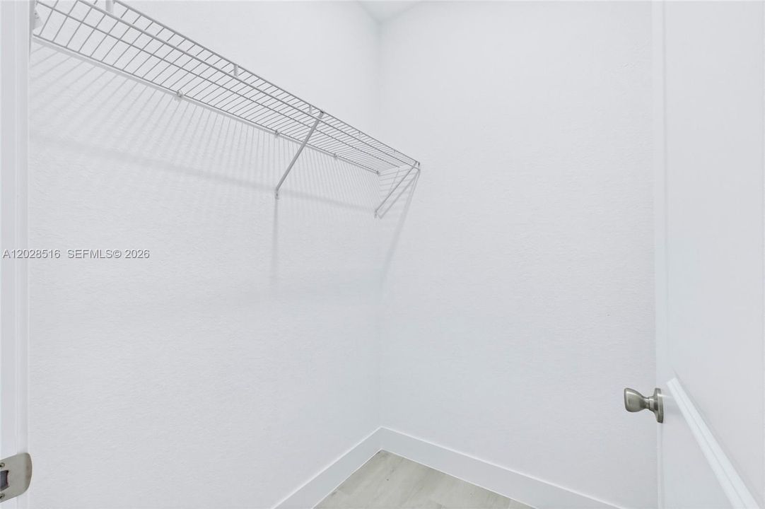 Expansive walk-in closet perfect for organizing clothes and accessories.