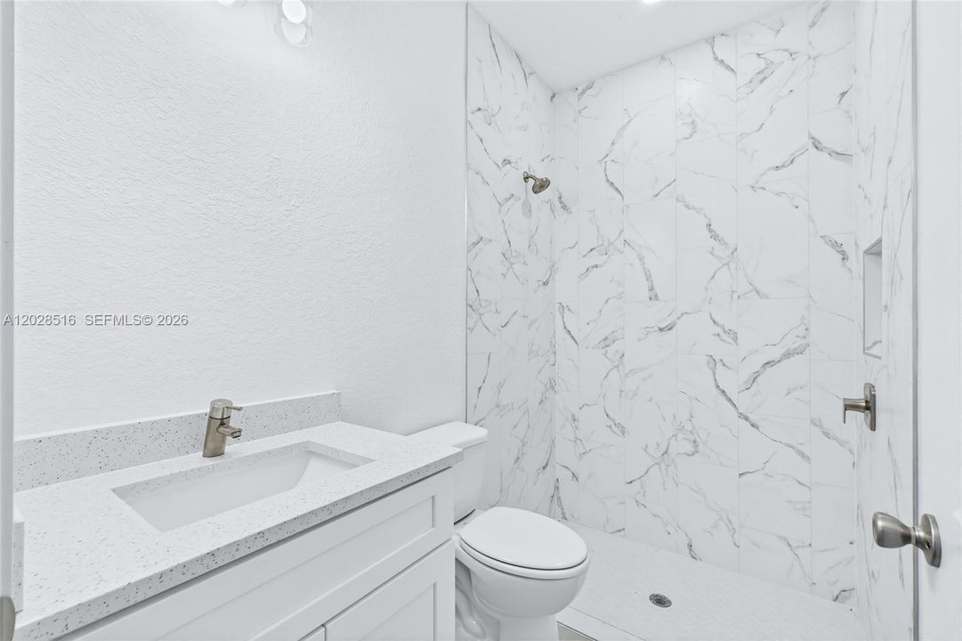 Contemporary primary bathroom with thoughtful design and quality finishes.