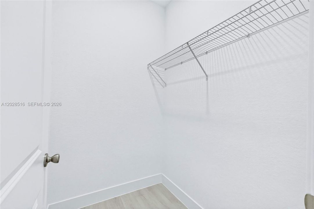 Spacious walk-in closet with ample storage and organization space.