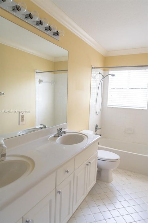 Upstairs Bathroom with double sink and tub/shower combo