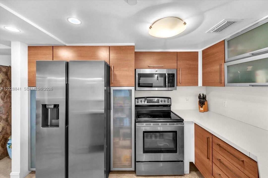 The living and dining area is spacious, open, and filled with natural light.