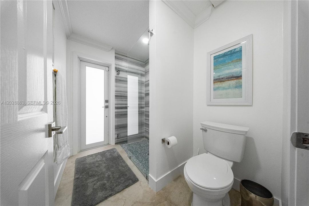 2nd Bathroom has a door to separate shower area from vanity for added privacy and convenience.