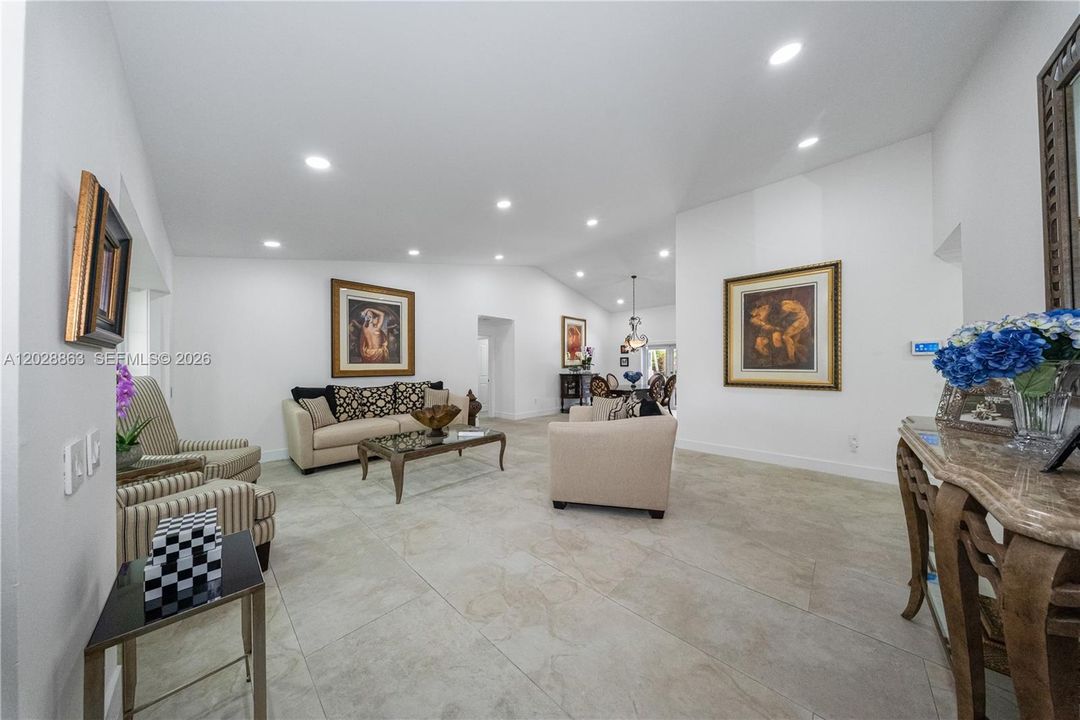 As you enter you are welcomed by high vaulted ceiling - LED lighting and 24 X 48 tiles.