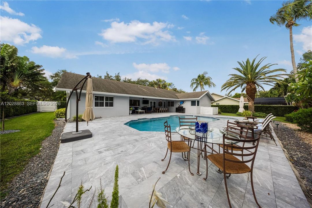 Mature landscaping provides lots of privacy to your backyard retreat.