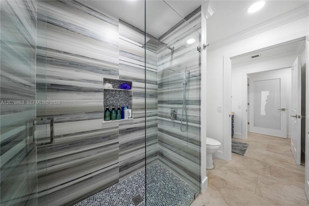 2nd Bathroom with glass shoer enclosure.