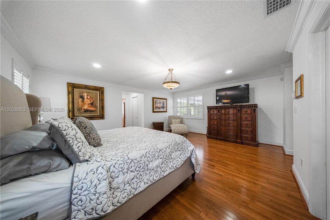 Primary bedroom with views to the fabulous backyard.