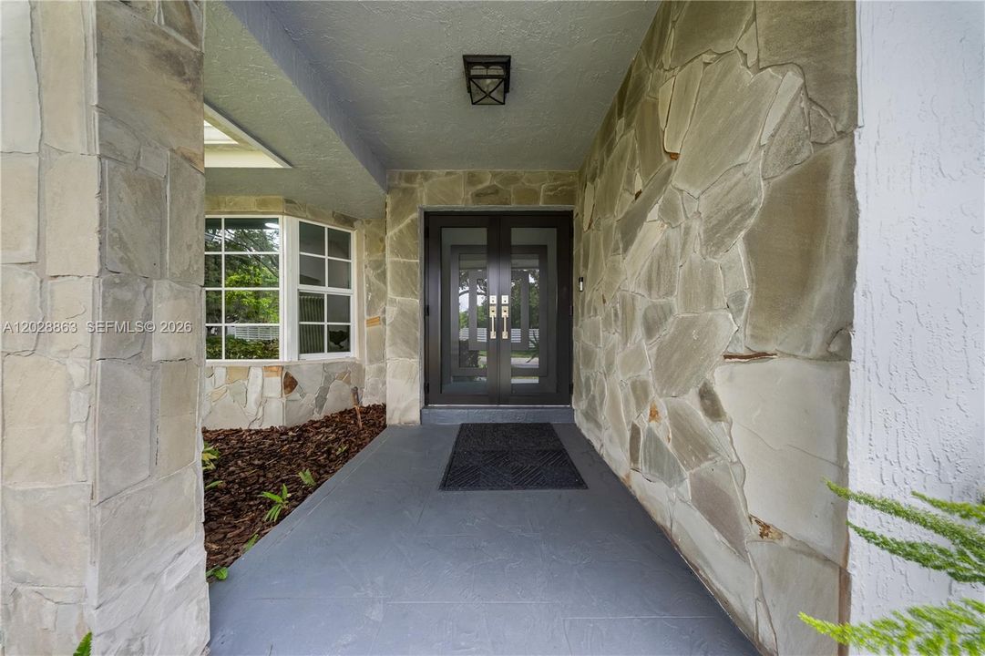 Double Door Entry - Impact Doors and Windows Throughout.