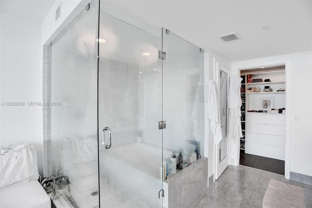 Master Bathroom has a tub and rain shower