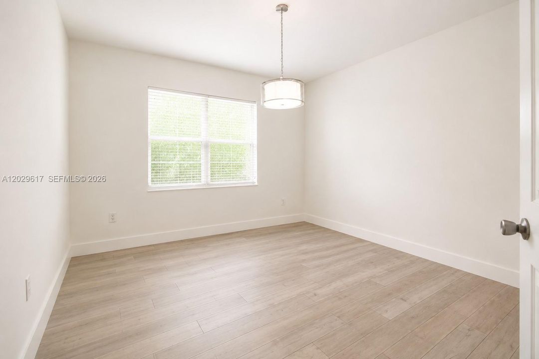 Primary bedroom large enough for a king-sized bed.