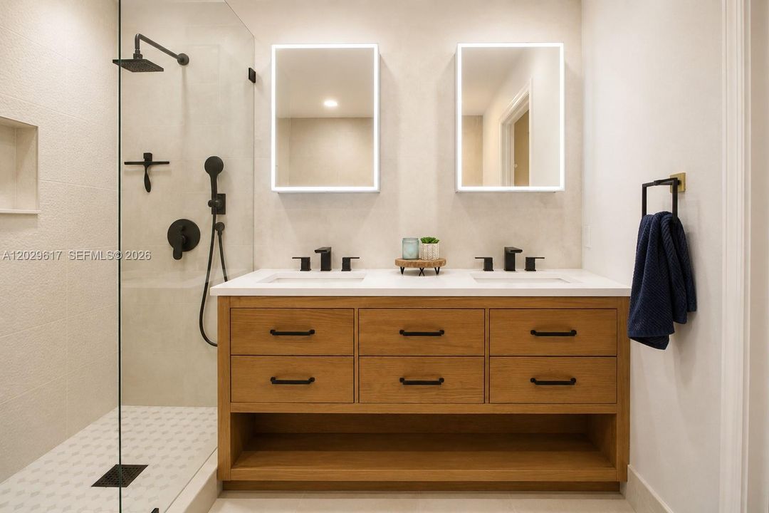 Primary bath with double sinks, stand in shower and soaking tub