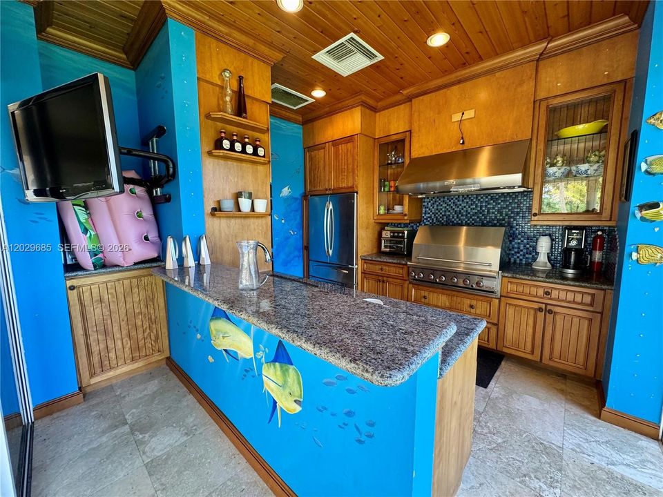 Full outdoor kitchen with grill