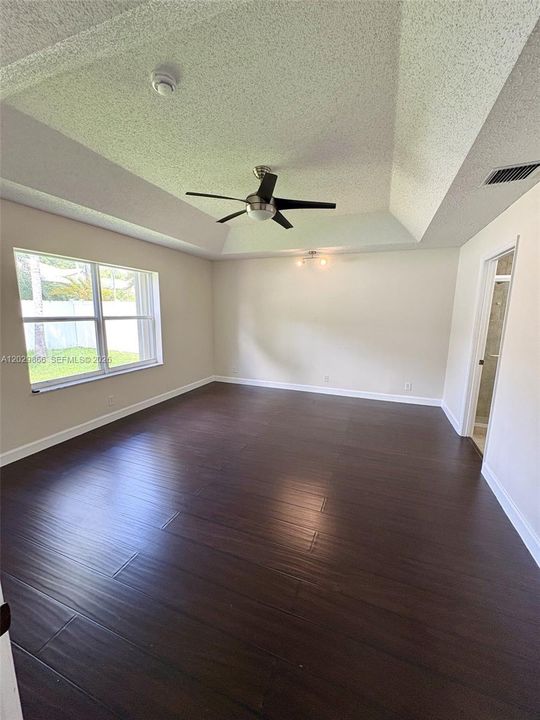 Primary bedroom walk in closet