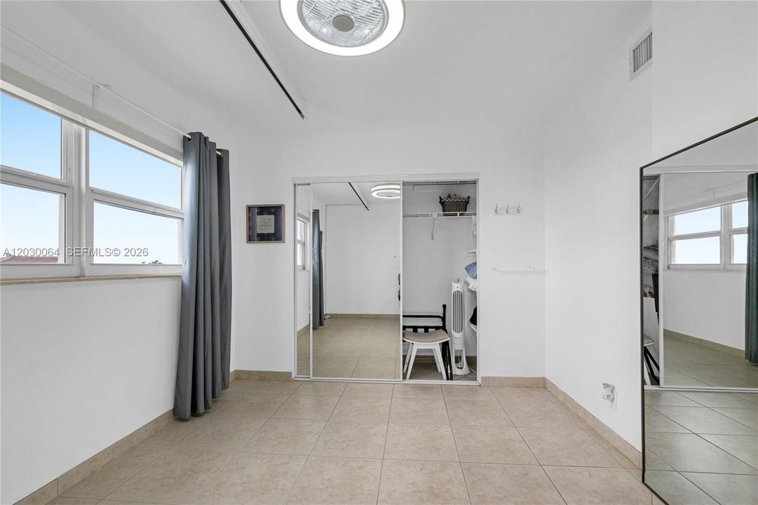 Second bedroom, impact windows and views of the beach and intracoastal.