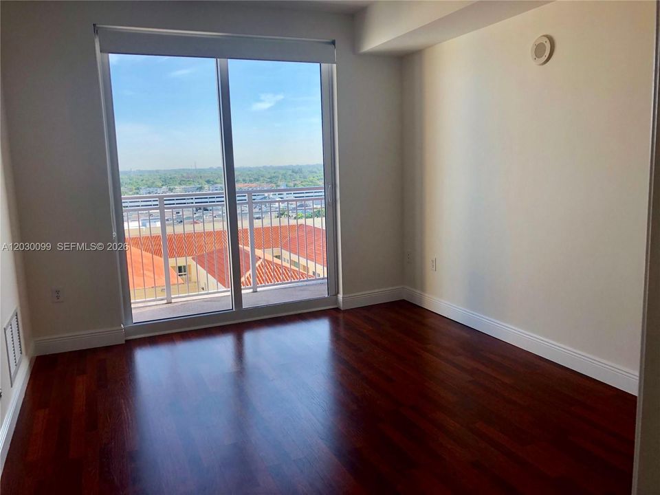 BEDROOM W/WOOD FLOORS