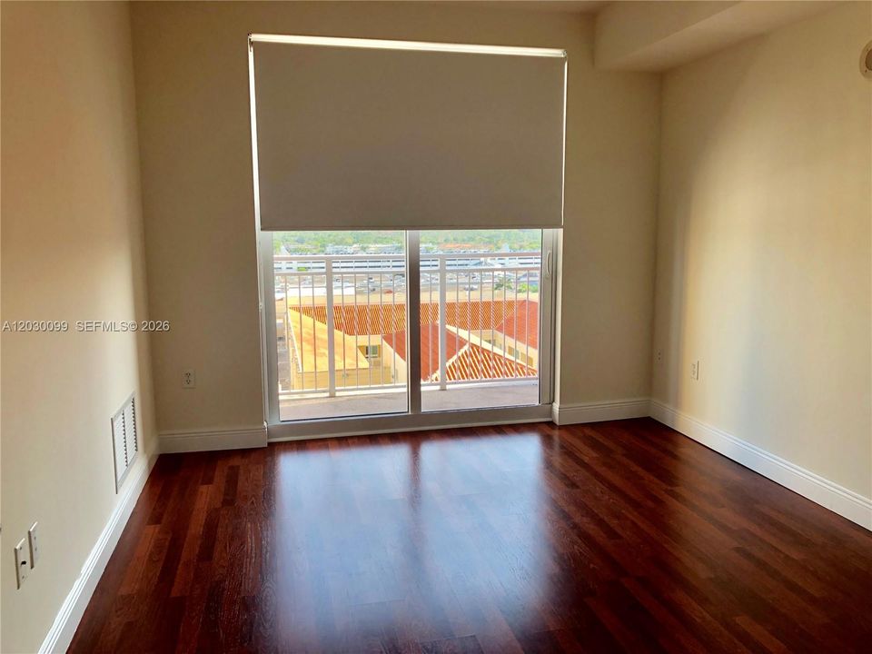 BEDROOM W/BLACK OUT AND WOOD FLOORS