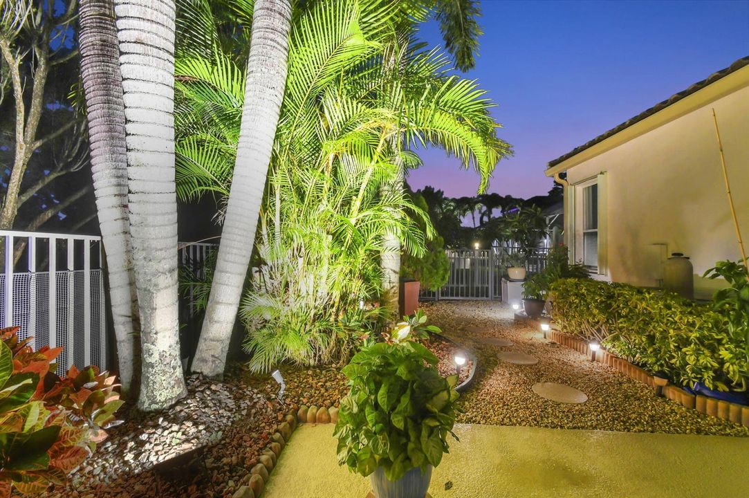 lit walkway to garden area