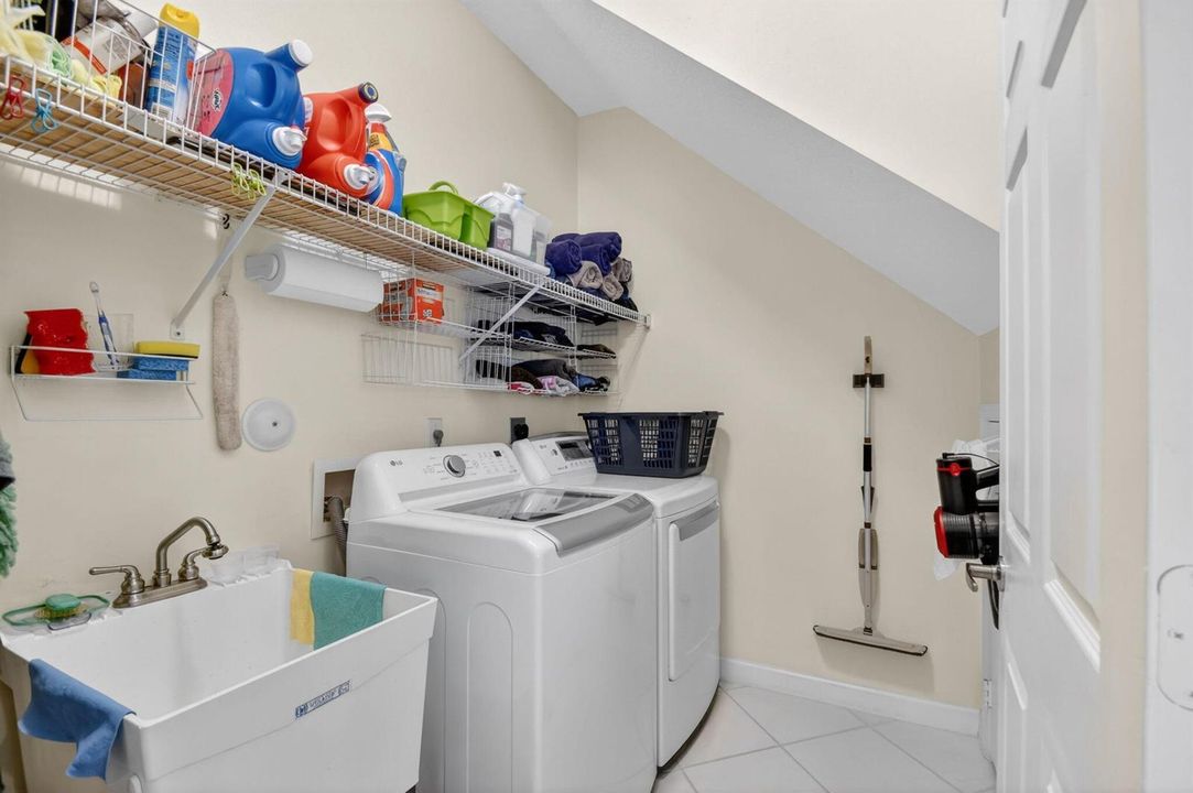laundry room with extra storage & sink