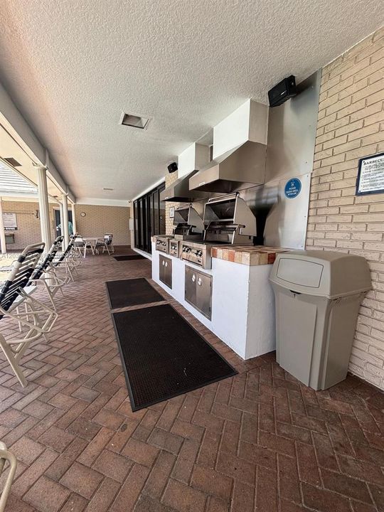 Poolside BBQ area, perfect for outdoor dining and entertaining.