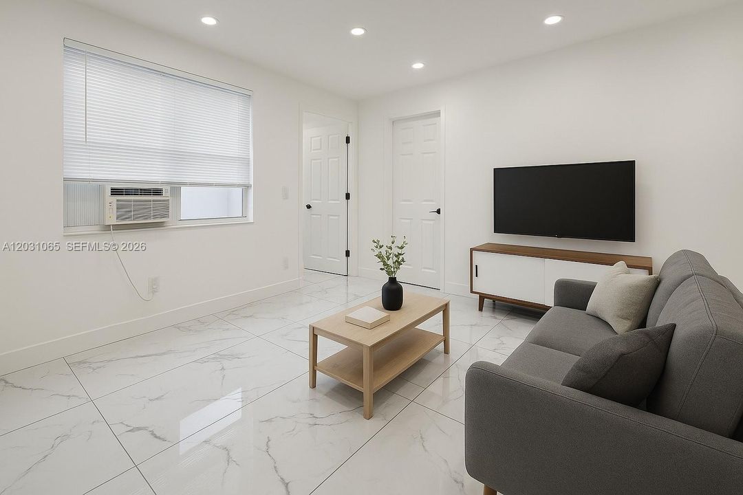 The unit is UNFURNISHED- This photo is VIRTUAL STAGED FOR VISUALIZATION