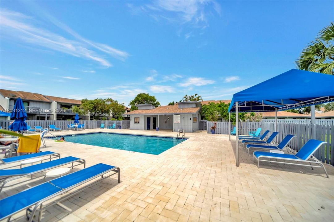 Pool area with new pool deck, furniture, shade and umbrellas. Bathrooms at pool area as well.