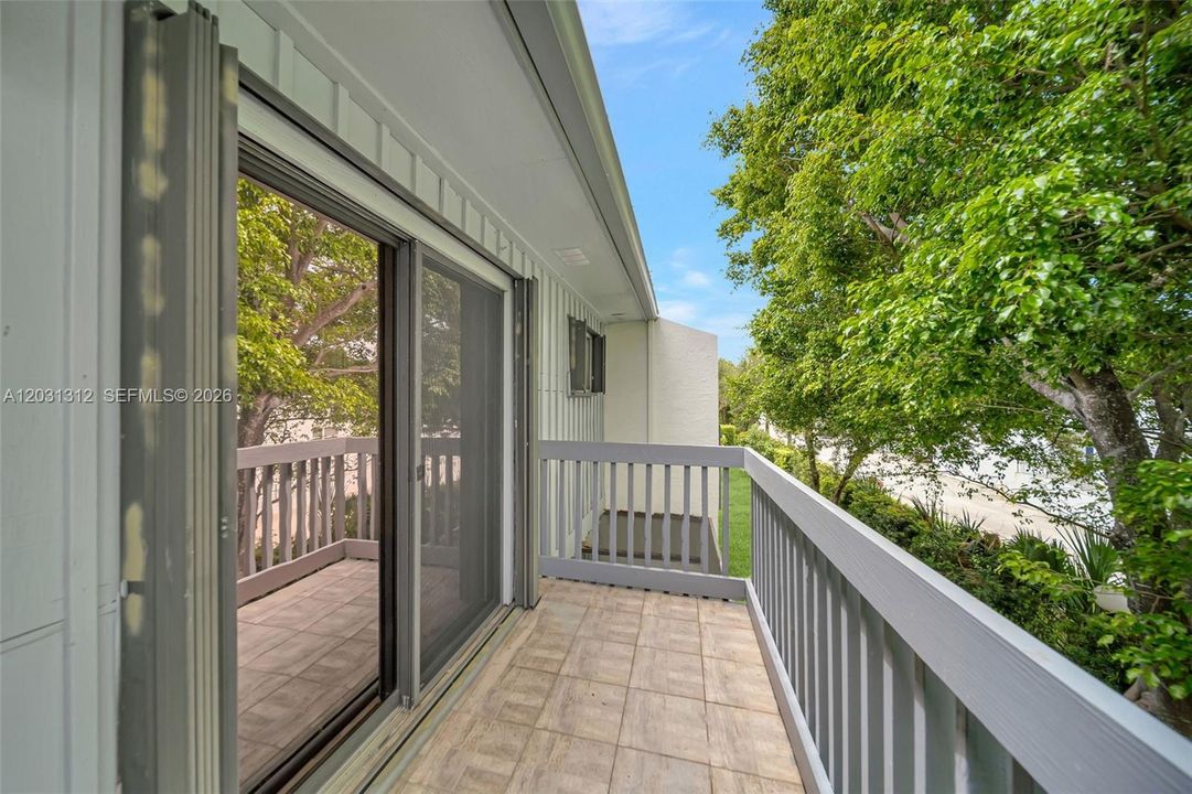 Accordion Hurricane shutters on sliding glass door and windows