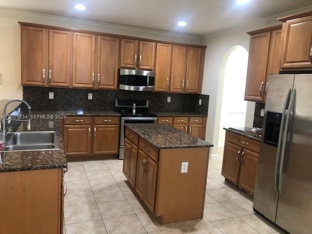 Stainless Steel Appliances-Lots of Cabinets-Nice Island