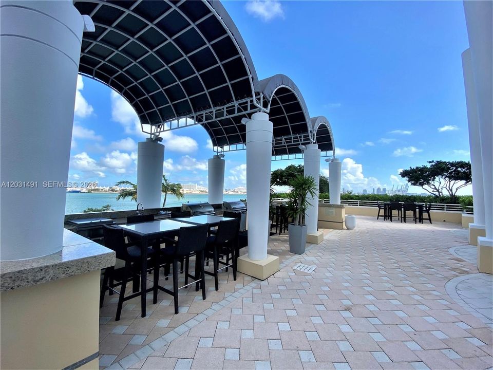 BBQ and entertainment area by pool