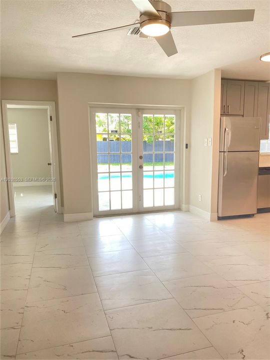 Next to the kitchen dinning area/access the outdoors