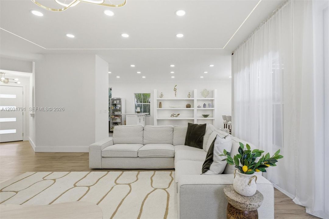 Living Area with Fully Curtained Wall at Right