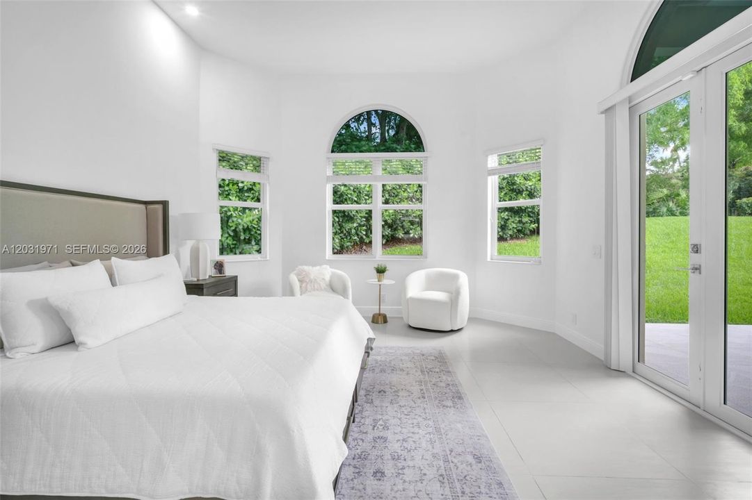 Fully furnished master bedroom overlooking the garden