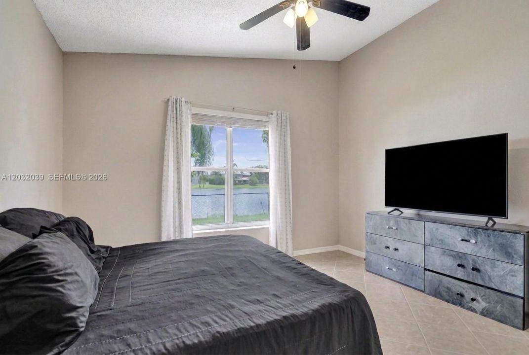 Reverse View of the Primary Bedroom with Water Views! (AI enhanced)
